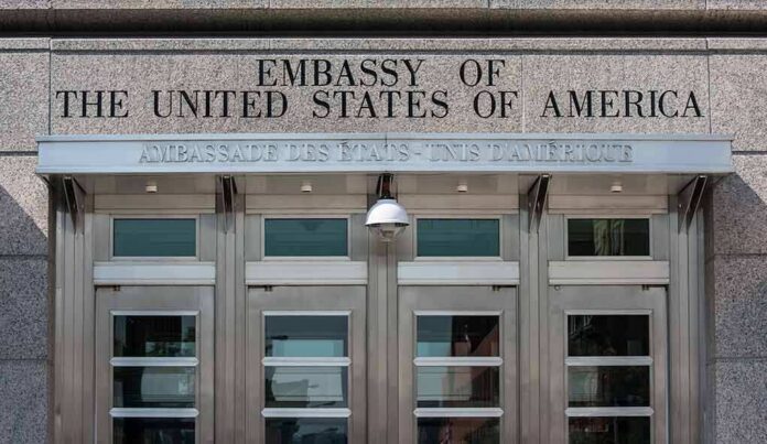 shutterstock_112985398 United States embassy entrance with metal doors and security camera