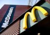 AI Price-Fixing Bombshell Hits McDonald’s McDonald's restaurant exterior with golden arches sign