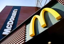 AI Price-Fixing Bombshell Hits McDonald’s McDonald's restaurant exterior with golden arches sign