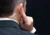 Threat Tsunami Slams Secret Service Man in suit with earpiece touching his ear