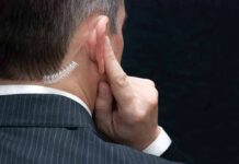 Threat Tsunami Slams Secret Service Man in suit with earpiece touching his ear