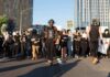 Nationwide School Uprising Erupts in France Protesters march on a city street holding signs