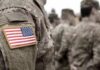 Okinawa Outrage: U.S. Marine Arrested Soldier uniform with U.S. flag patch in focus