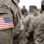 Soldier uniform with U.S. flag patch in focus