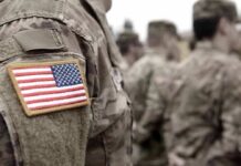 Soldier uniform with U.S. flag patch in focus