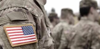 Soldier uniform with U.S. flag patch in focus