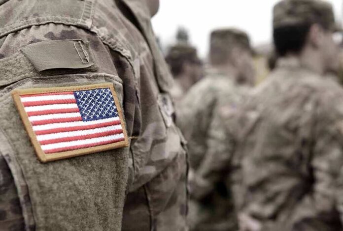Soldier uniform with U.S. flag patch in focus