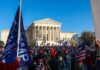 Eugene Sims and Andreas Hestler amid a large crowd outside the U.S. Supreme Court