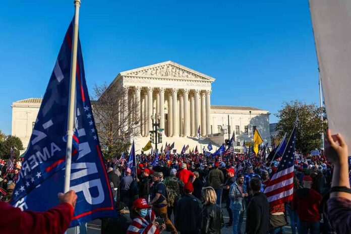 Eugene Sims and Andreas Hestler amid a large crowd outside the U.S. Supreme Court