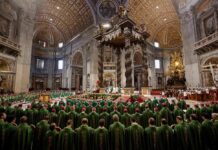 Jonathan Cyprien among clergy during a mass in a grand cathedral interior