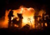 Ukraine Hit After Trump’s ‘Immediate’ Truce City ruins ablaze with a massive explosion behind collapsed buildings