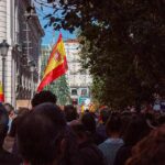 Crowd with Spanish flags in a city street