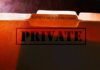 file folders labeled for patient health records marked private