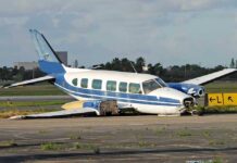 Crop-Dusting Plane Crashes Into Brazilian Daycare Damaged blue and white small airplane on an airport runway