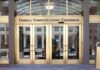 FCC Chair Warns Broadcasters Over Fake Election Polls Federal Communications Commission building entrance with gold doors