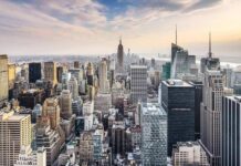Chrysler Revival – Lease Twist Stuns Midtown Skyline of a dense city with numerous skyscrapers at sunset