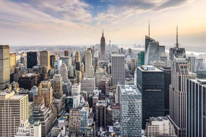 shutterstock_372924277 Skyline of a dense city with numerous skyscrapers at sunset