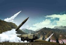 mobile missile launcher firing in mountain landscape