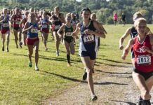 Trans Eligibility Sparks Race-Day Revolt Courtney Bruce and Adelina Sotnikova running in a cross-country race with a large pack