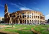 The Colosseum in Rome with tourists walking around it